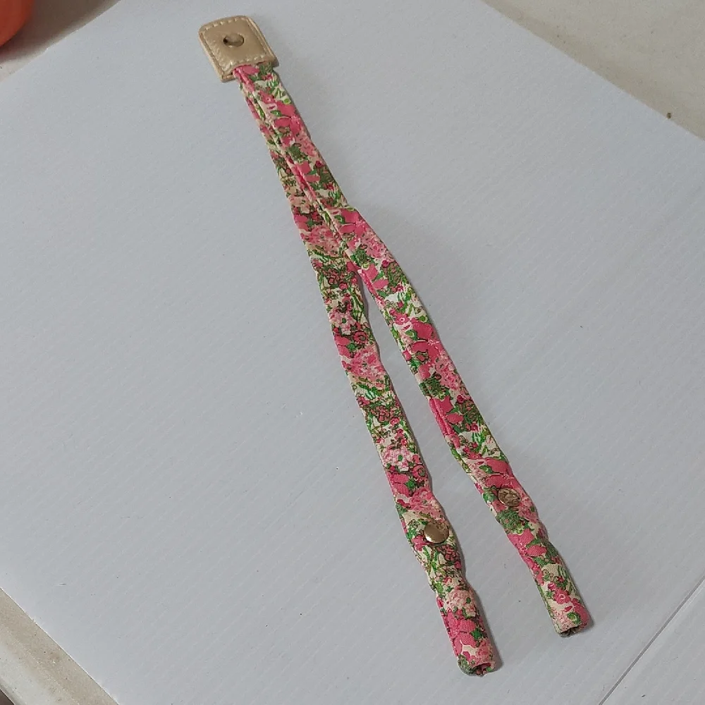 Lilly Pulitzer floral sunglass strap with pink and green colors.